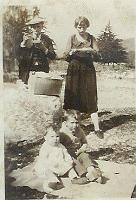  From left to right, Clifton Ingram (father), Ester Speed Ingram (mother), believed to be Joanne Ingram (daughter), and Billie Ingram (son). On a picnic in the mountains.